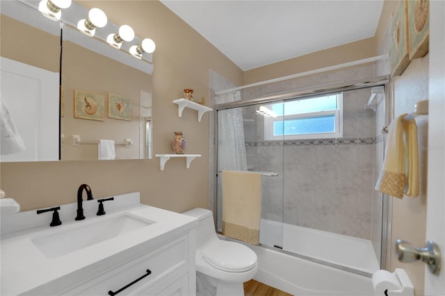 full bathroom with toilet and vanity