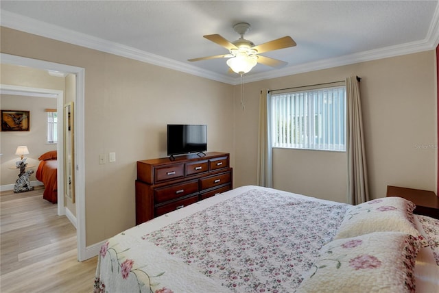 bedroom with ceiling fan, ornamental molding, light wood-style flooring, and baseboards