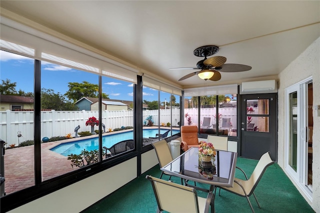 sunroom featuring ceiling fan and an AC wall unit