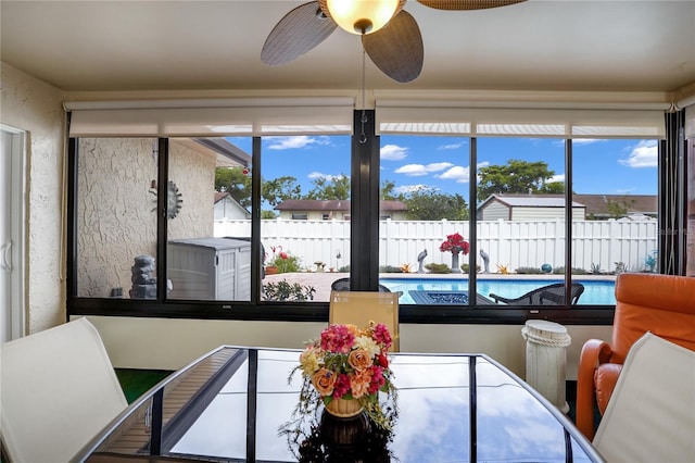 dining room featuring a healthy amount of sunlight and ceiling fan