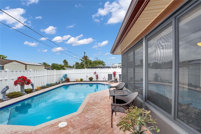 view of pool featuring a patio area, a fenced backyard, and a fenced in pool