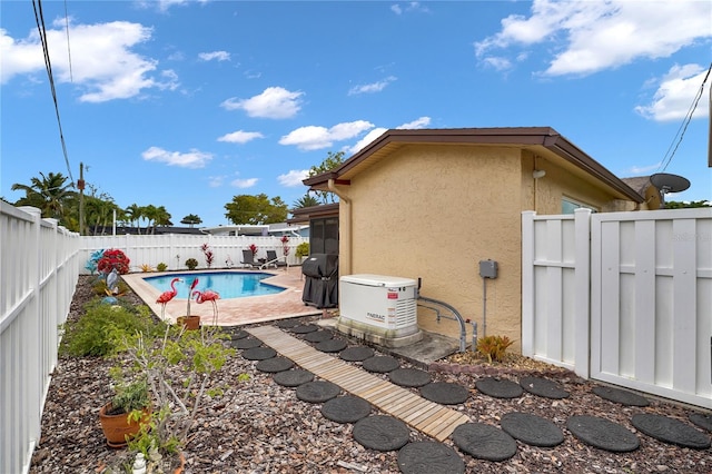 view of swimming pool featuring a patio, a fenced backyard, and a fenced in pool