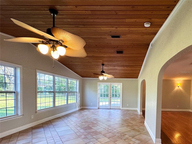 spare room with arched walkways, wooden ceiling, baseboards, ceiling fan, and vaulted ceiling