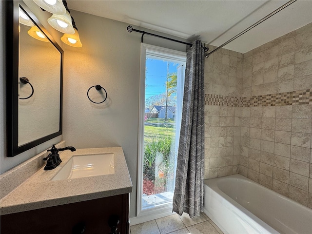 bathroom with tile patterned floors, shower / tub combo with curtain, and vanity