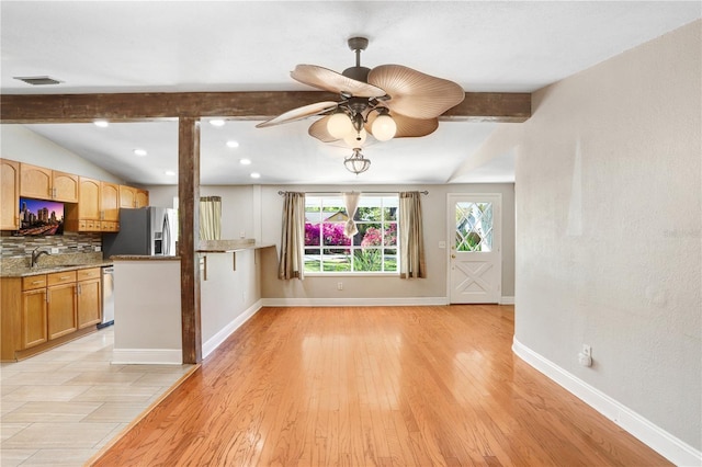 kitchen featuring tasteful backsplash, visible vents, baseboards, light wood-style flooring, and appliances with stainless steel finishes