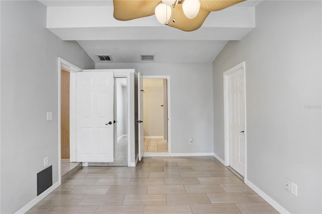 unfurnished bedroom with visible vents, baseboards, and ceiling fan
