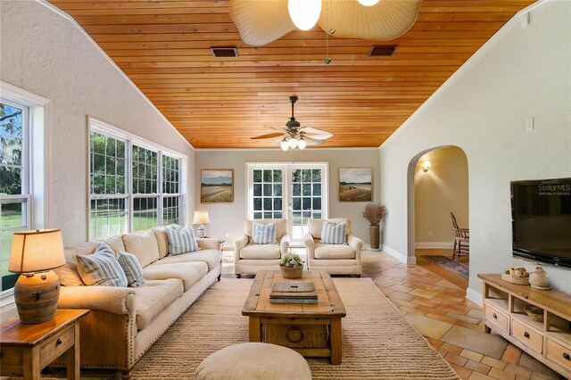 19531 Deer Lake Rd, Lutz, FL 33548 - living area featuring wood ceiling, ceiling fan, lofted ceiling, arched walkways, and baseboards