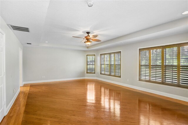 19531 Deer Lake Rd, Lutz, FL 33548 - spare room with a ceiling fan, wood finished floors, baseboards, a textured ceiling, and recessed lighting