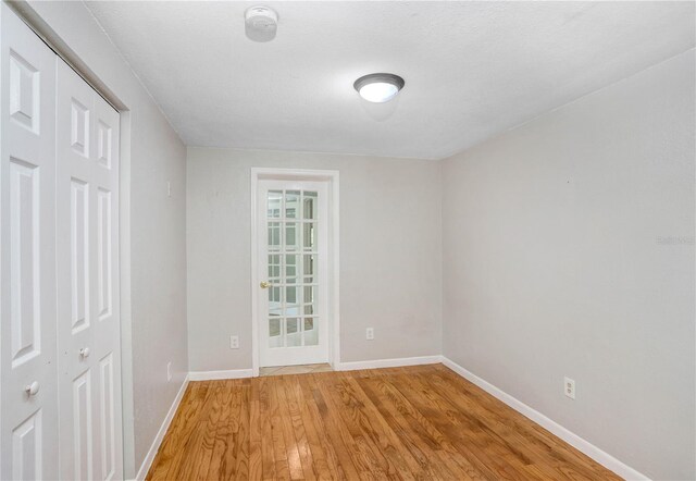 19531 Deer Lake Rd, Lutz, FL 33548 - unfurnished bedroom featuring light wood-style floors, baseboards, and a closet