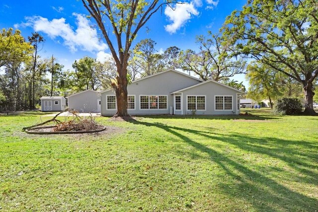 19531 Deer Lake Rd, Lutz, FL 33548 - back of house featuring a yard