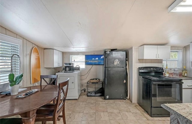 kitchen featuring washer / dryer, light countertops, white cabinets, and black appliances