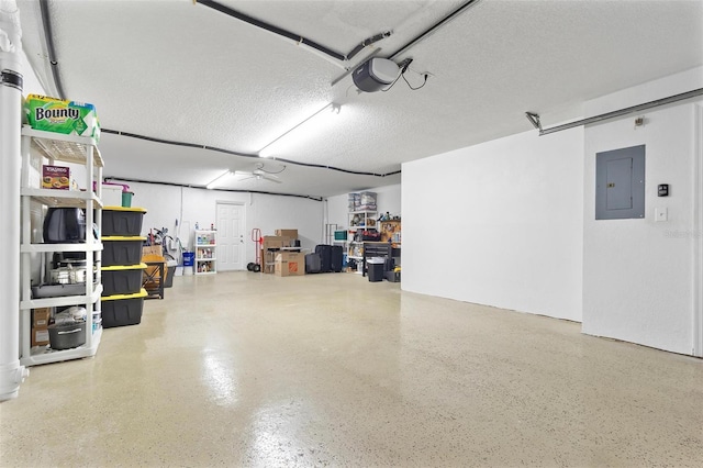 garage featuring a garage door opener and electric panel