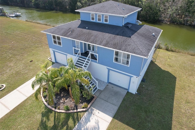 birds eye view of property featuring a water view