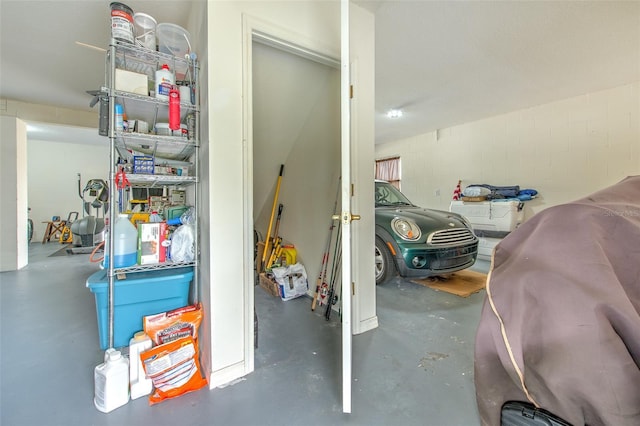 interior space with concrete block wall