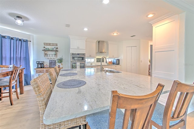 dining room with visible vents, recessed lighting, and light wood-style floors