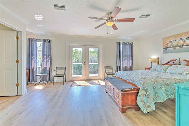 bedroom with access to exterior, visible vents, french doors, and ornamental molding