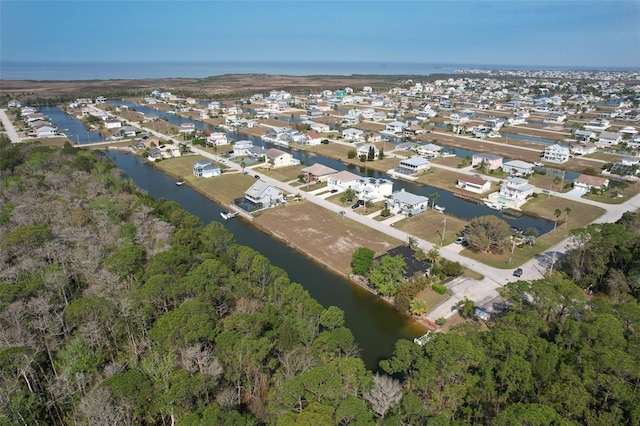 bird's eye view with a residential view and a water view