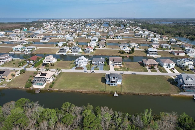 birds eye view of property with a residential view and a water view