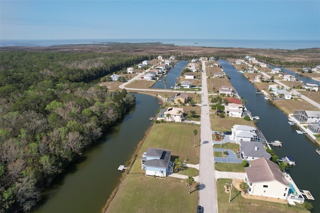 bird's eye view featuring a water view and a residential view