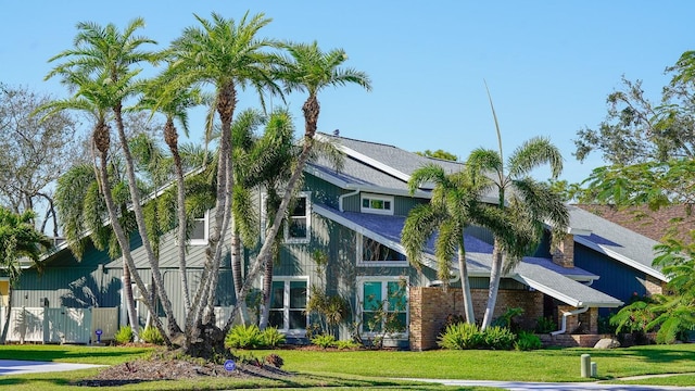 exterior space with a front yard and fence