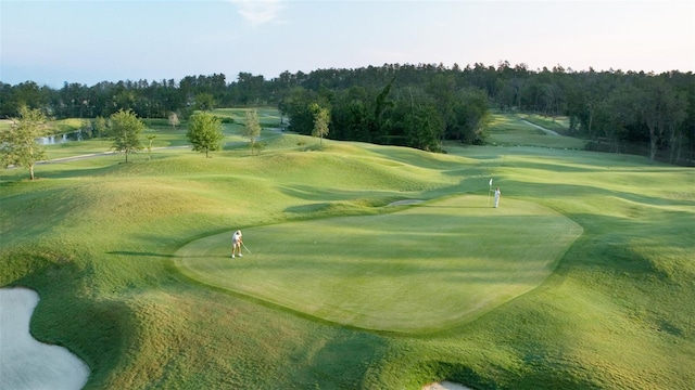 view of community featuring view of golf course