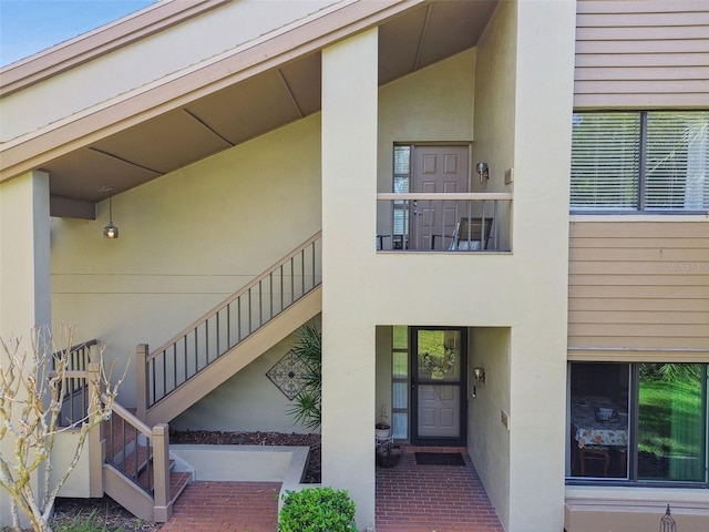 entrance to property with stucco siding