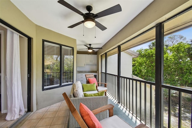 balcony featuring a ceiling fan