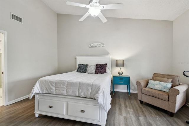 bedroom with a ceiling fan, baseboards, visible vents, and wood finished floors