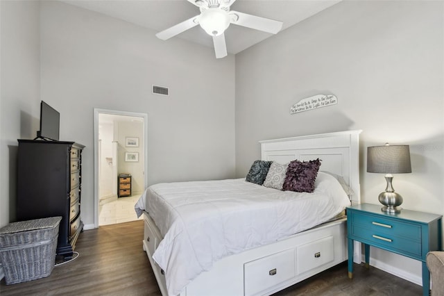 bedroom featuring ceiling fan, dark wood finished floors, visible vents, and baseboards