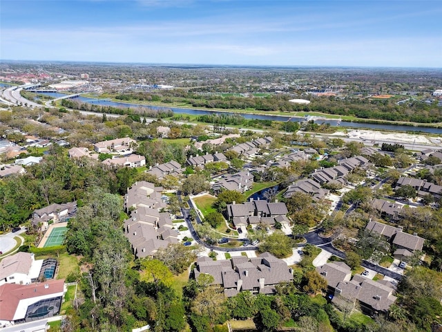 birds eye view of property featuring a residential view and a water view