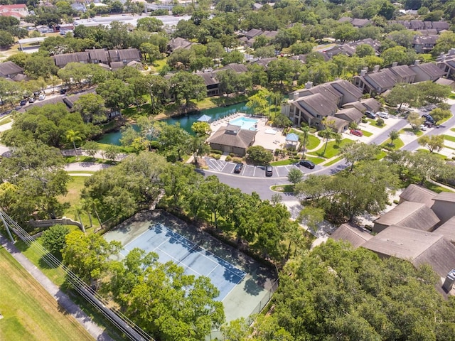 drone / aerial view featuring a water view and a residential view