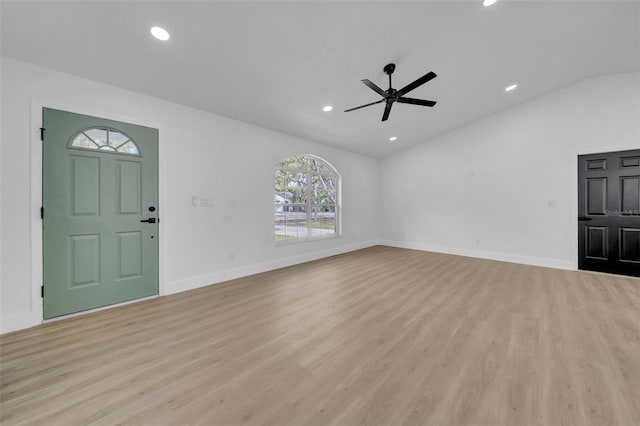 foyer featuring recessed lighting, light wood-type flooring, baseboards, and vaulted ceiling