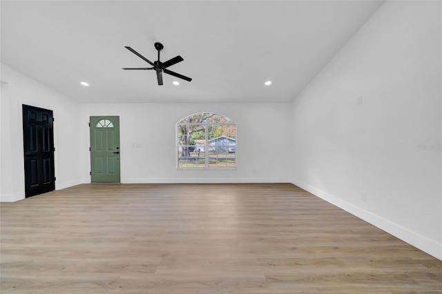 unfurnished living room with recessed lighting, light wood-style flooring, baseboards, and a ceiling fan