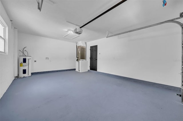 garage featuring baseboards, a garage door opener, and water heater