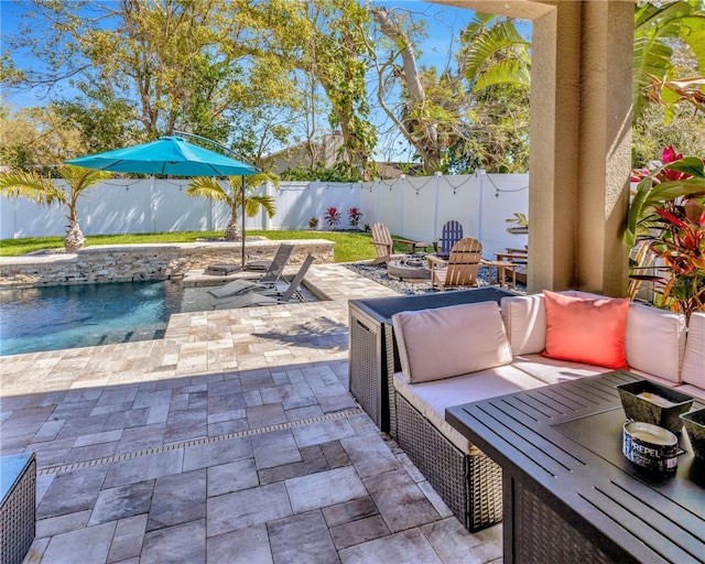 view of patio / terrace with a fire pit and a fenced backyard