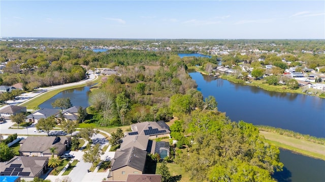 drone / aerial view featuring a residential view and a water view