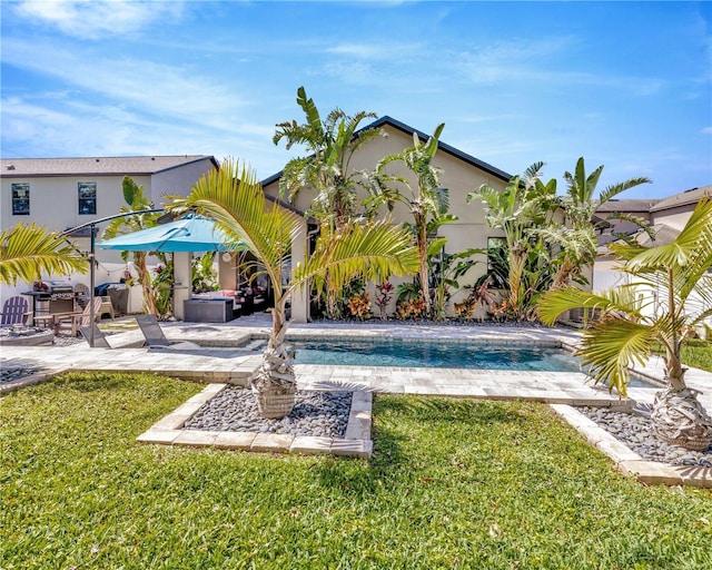 view of yard with an outdoor pool and a patio