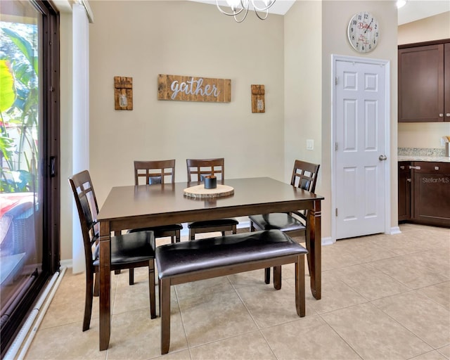 dining room featuring light tile patterned flooring and baseboards