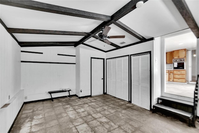 unfurnished bedroom featuring light floors, two closets, visible vents, lofted ceiling with beams, and ceiling fan