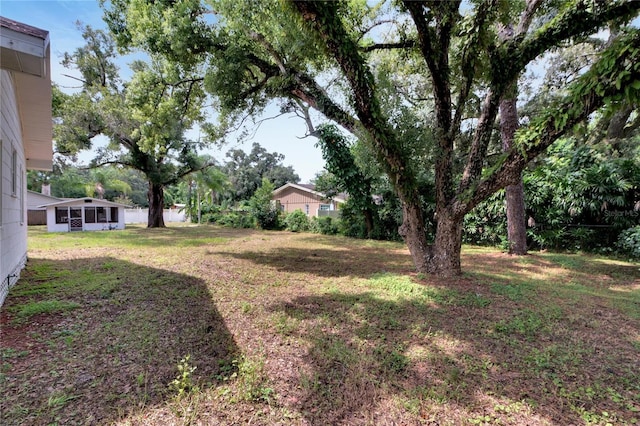 view of yard featuring a sunroom