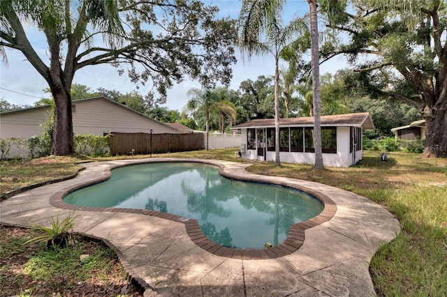 outdoor pool featuring fence