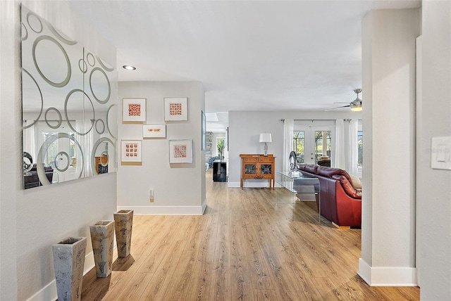 interior space with baseboards and wood finished floors