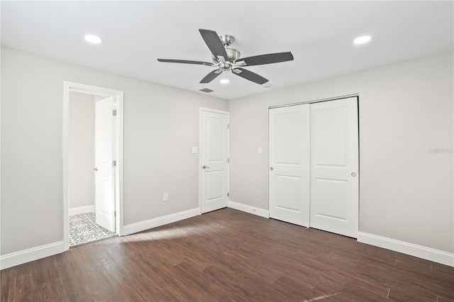 unfurnished bedroom with dark wood-style floors, recessed lighting, and baseboards