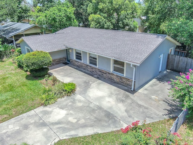 2412 Giddens Ave, Seffner, FL 33584 - ranch-style house with stucco siding, stone siding, and roof with shingles