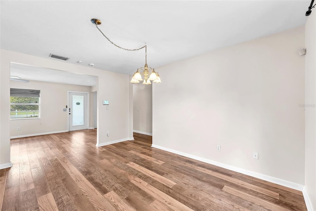 2412 Giddens Ave, Seffner, FL 33584 - spare room with a chandelier and wood finished floors