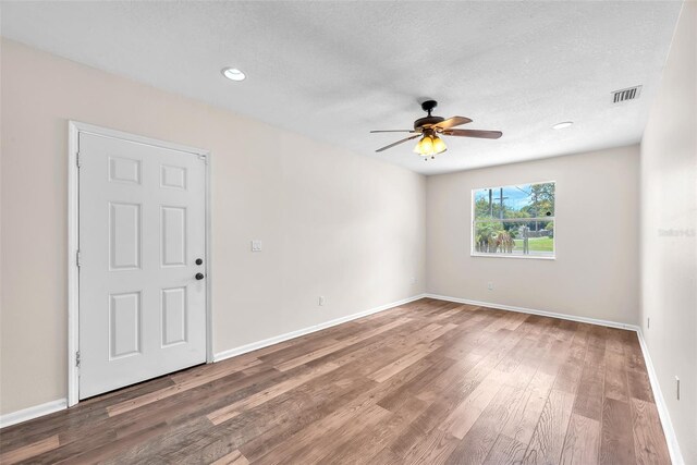 2412 Giddens Ave, Seffner, FL 33584 - spare room with ceiling fan, wood finished floors, recessed lighting, and a textured ceiling