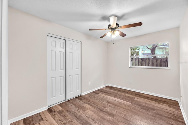 2412 Giddens Ave, Seffner, FL 33584 - unfurnished bedroom with a closet, wood finished floors, and ceiling fan