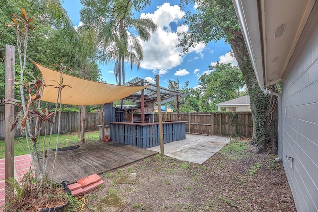 2412 Giddens Ave, Seffner, FL 33584 - fenced backyard featuring a deck and a patio