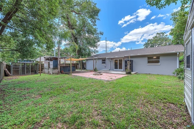 2412 Giddens Ave, Seffner, FL 33584 - rear view of house featuring a fenced backyard, a patio area, and concrete block siding