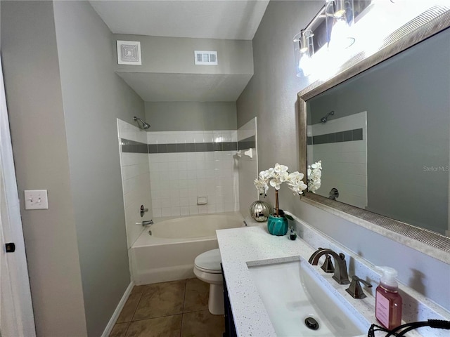 full bathroom with tile patterned flooring, toilet, vanity, visible vents, and shower / washtub combination